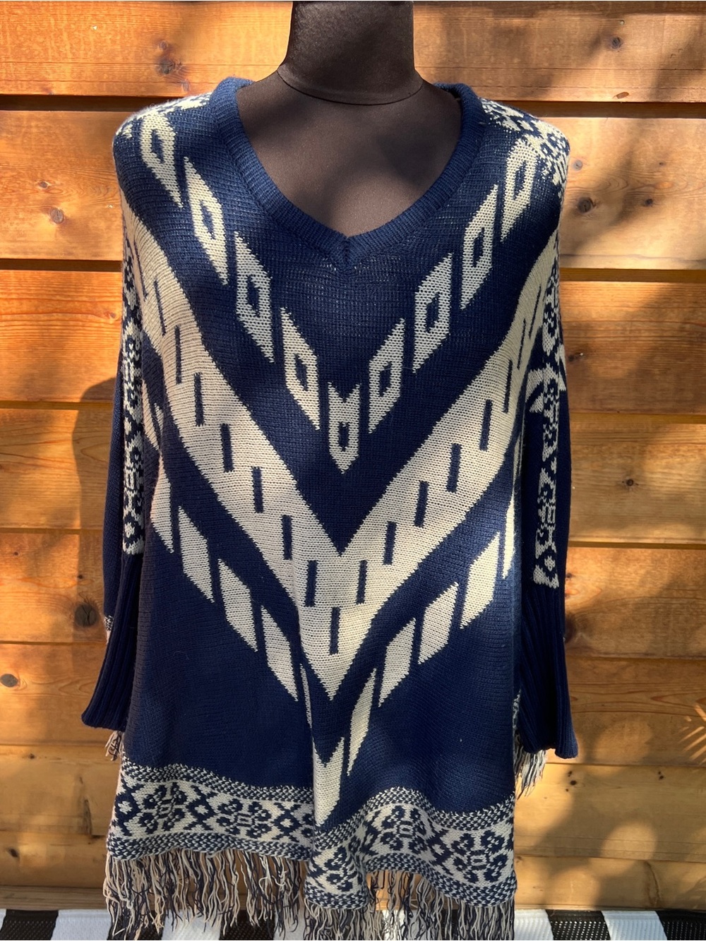 Say What? Navy and Cream V‑Neck Fringe Poncho Sweater